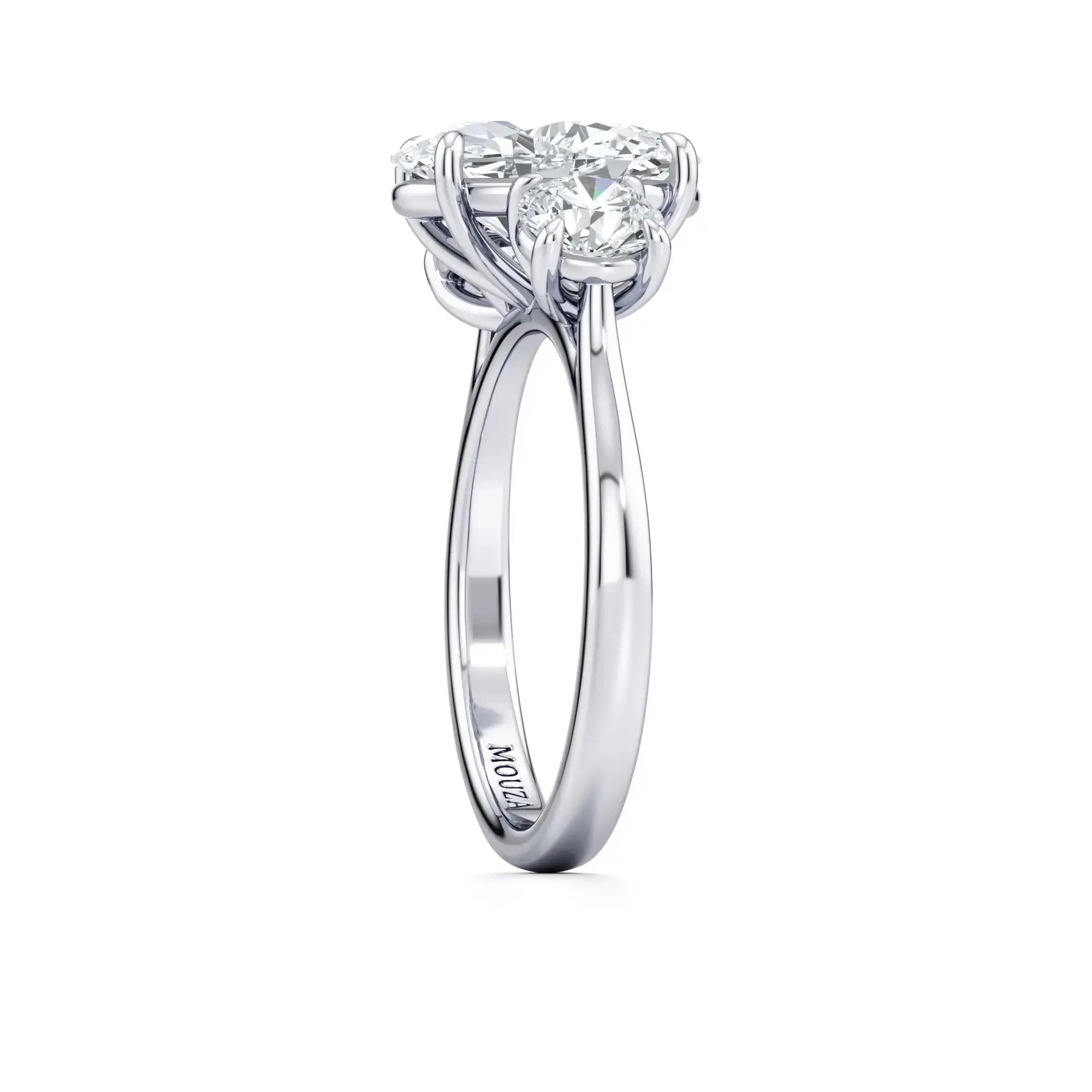 A classic trilogy diamond band engagement ring having the brand name 'Mouza' on it.