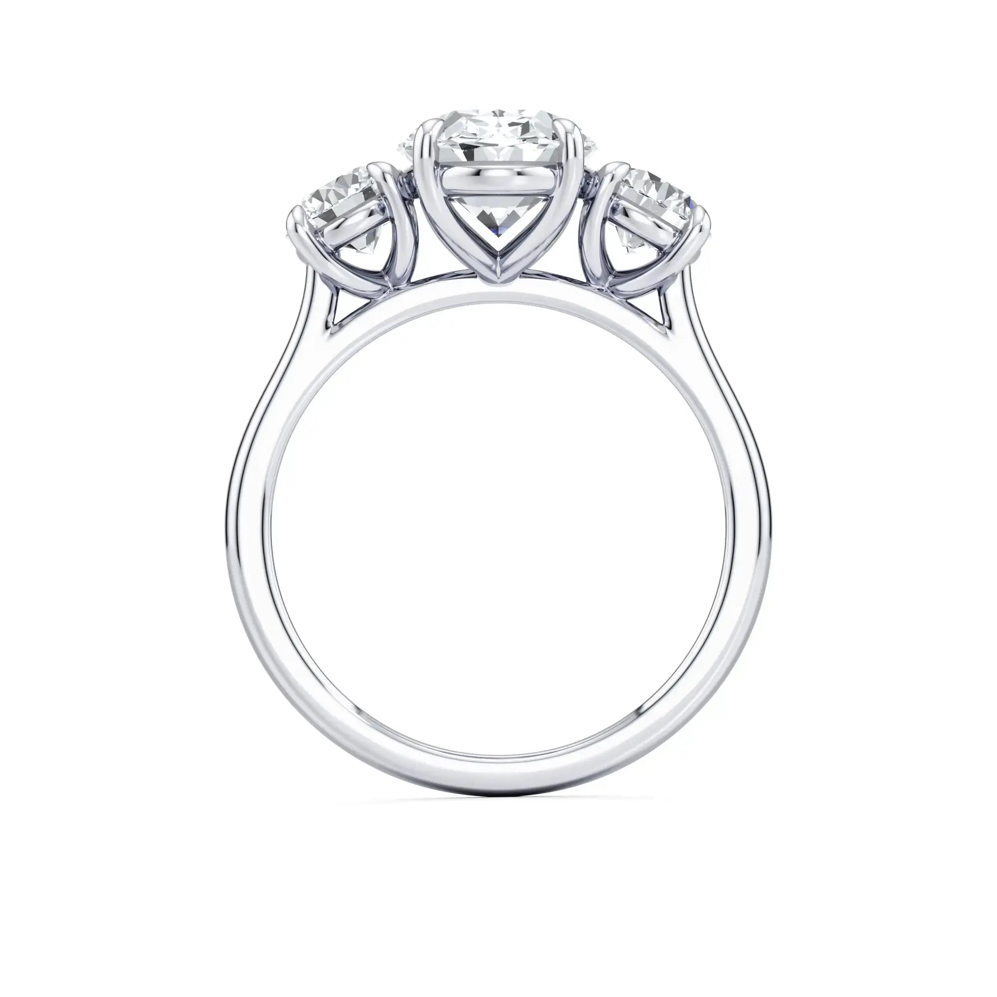 A classic three-stone diamond engagement ring with round side stones and a central oval diamond
