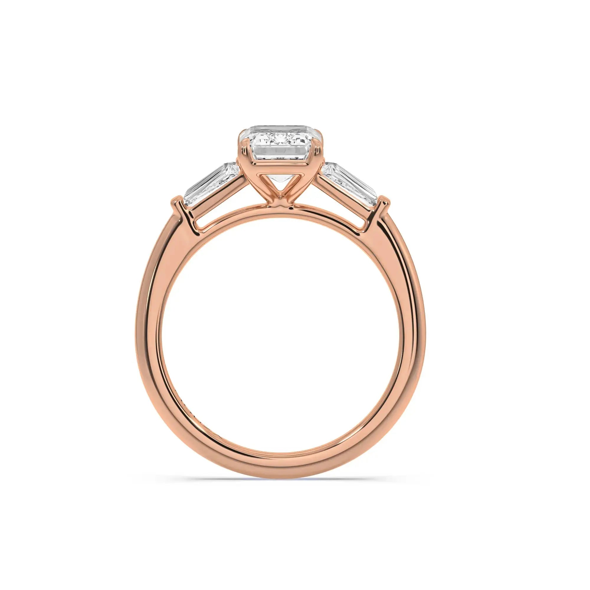 A sleek and timeless engagement ring featuring a central emerald-cut diamond in a rose gold band from Mouza