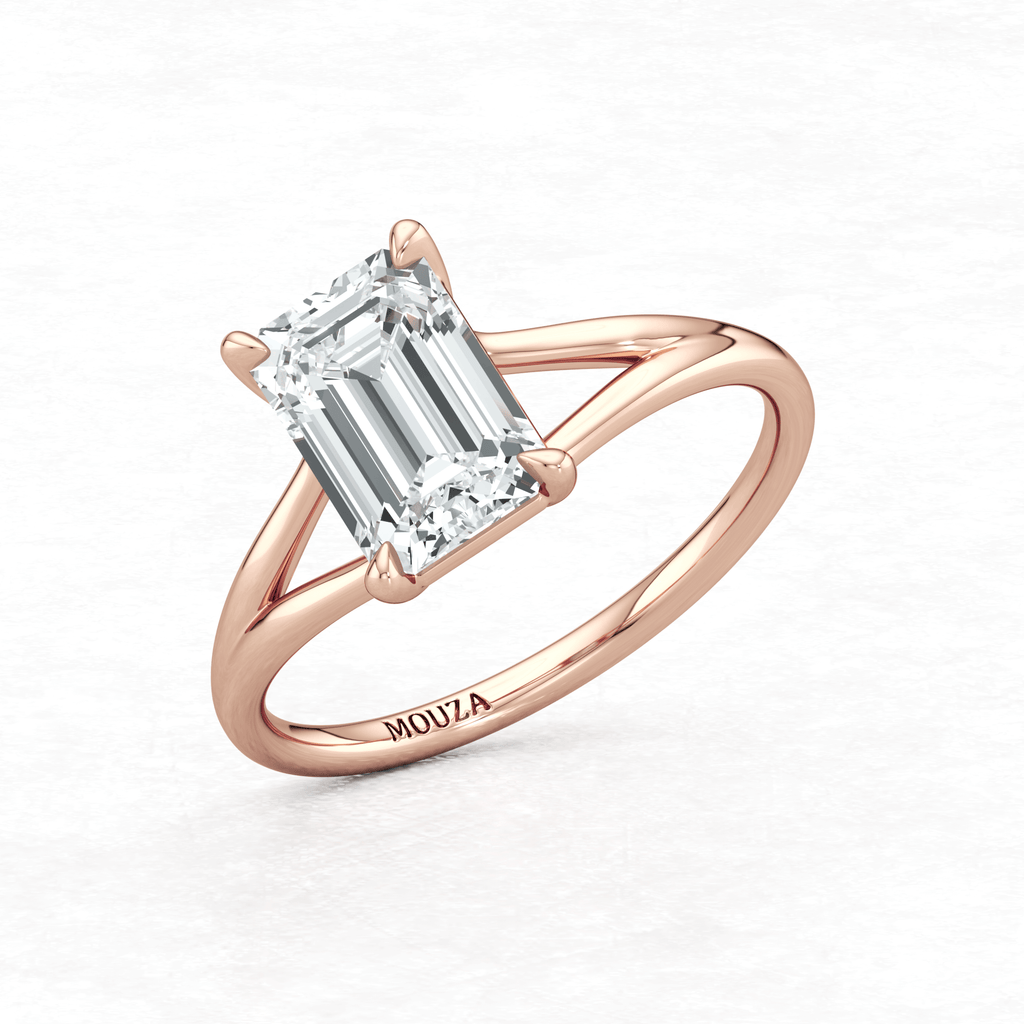 Maggy Solitaire Engagement Ring having a sleek contemporary design and brand name Mouza engraved on the rose gold metal band.