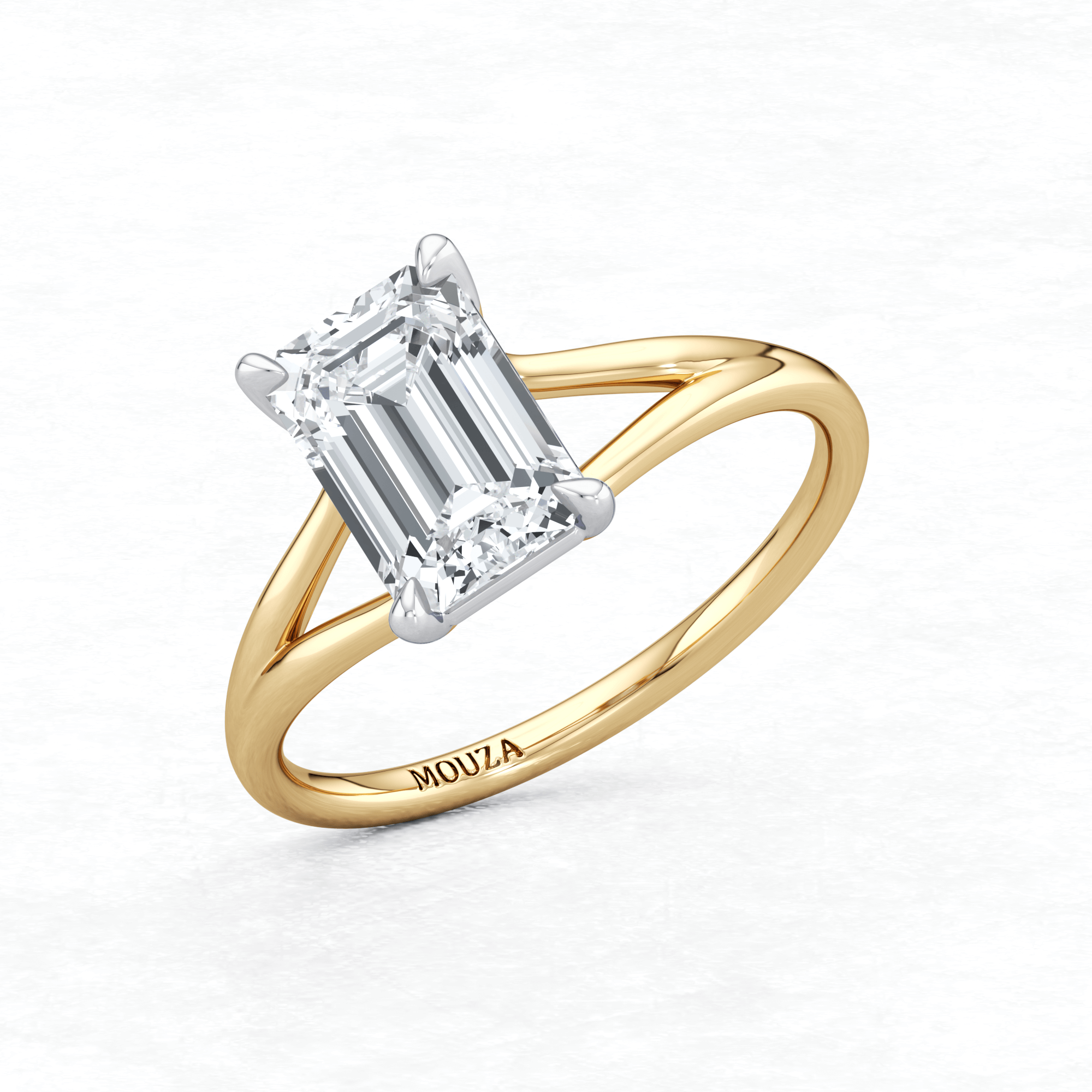 Two Tone Maggy Solitaire Engagement Ring featuring a split shank that elegantly frames the centre stone having brand name Mouza on the metal band.