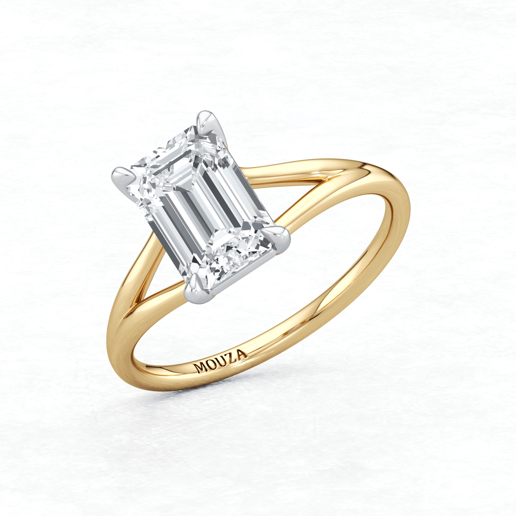 Two Tone Maggy Solitaire Engagement Ring featuring a split shank that elegantly frames the centre stone having brand name Mouza on the metal band.