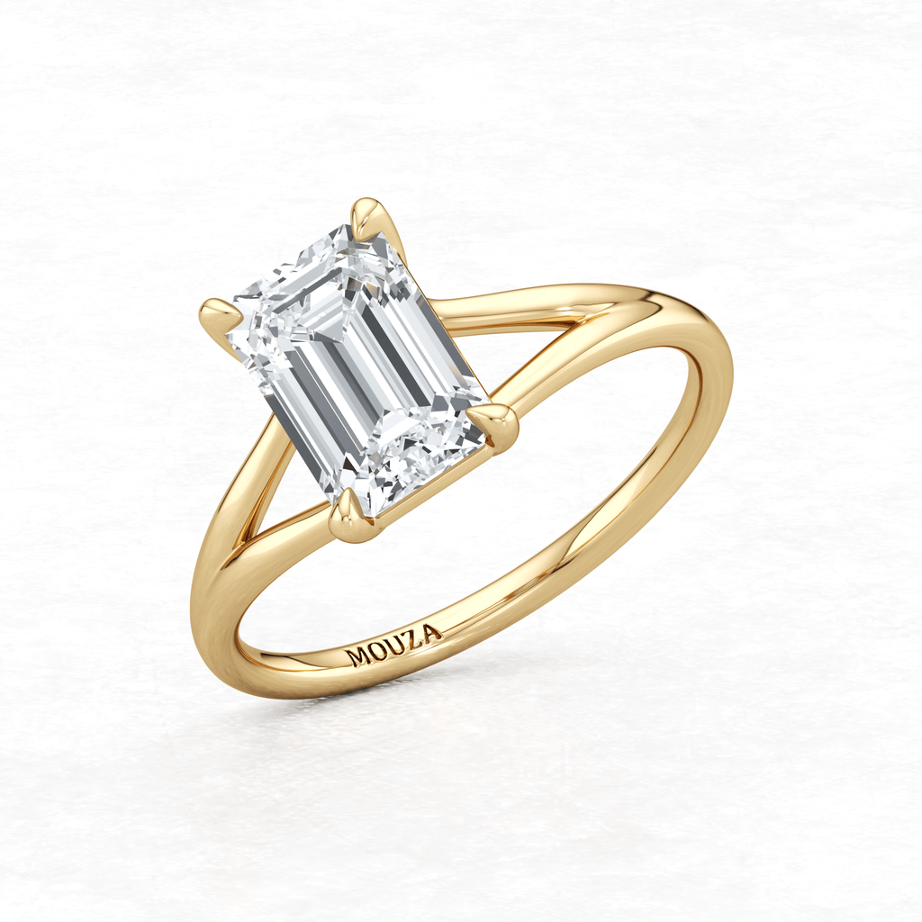 Yellow Gold Maggy Solitaire Engagement Ring having a sleek and contemporary design with brand name Mouza engraved on it