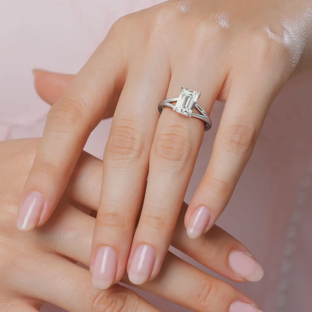 Elegant White Gold Maggy Solitaire Engagement Ring featuring a split shank that elegantly frames the centre stone from Mouza, Hatton Garden.